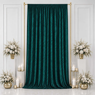 Emerald green velvet backdrop with gold frame and white floral arrangements