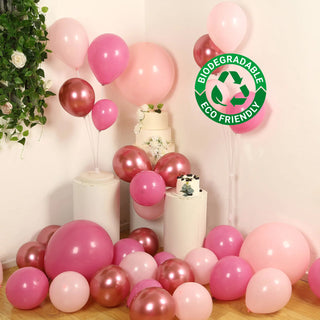 Assorted biodegradable pink and rose gold balloons for eco-friendly celebrations. #whtbkgd