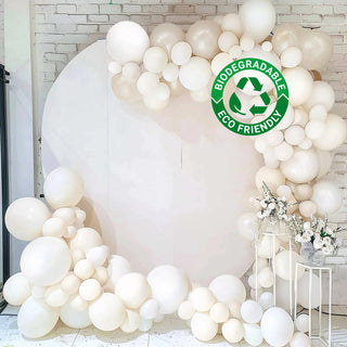 Biodegradable eco-friendly balloon decoration backdrop with white balloons.