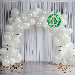 Eco-friendly biodegradable balloons in an elegant archway setup.