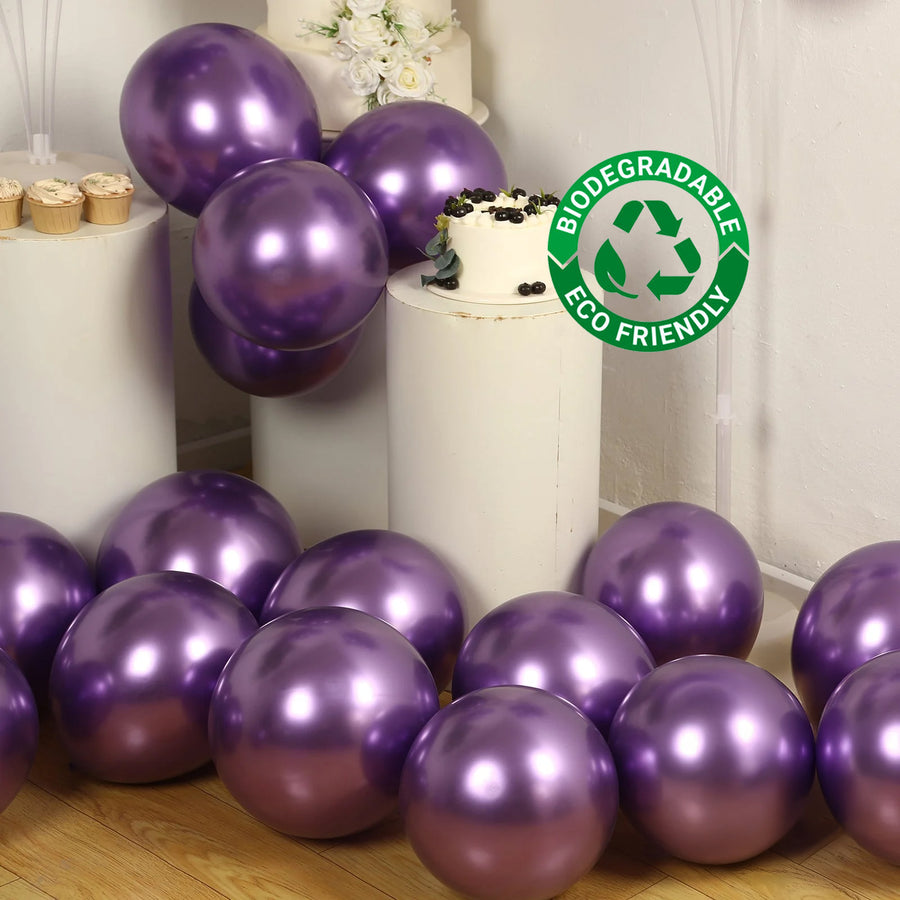 Purple biodegradable balloons scattered around a cake and dessert display.