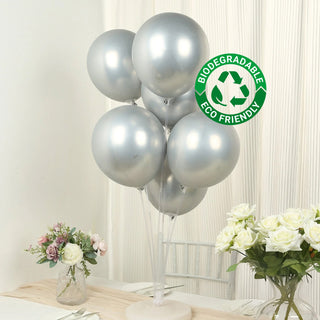 Silver biodegradable balloons in a stylish display. Eco-friendly party decor.