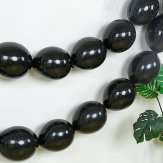 Black balloons garland decor for parties and celebrations.