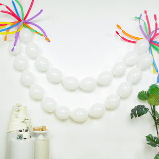 Decorative white balloons with colorful accents for party decor.