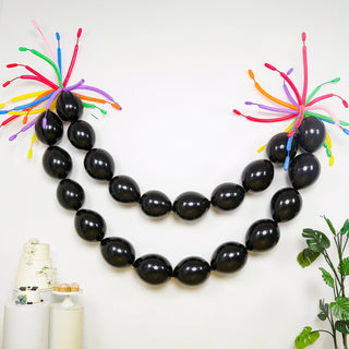 Black balloon garland with colorful balloon accents for festive decor.