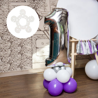 Silver number one balloon on a colorful balloon base in a festive setting.