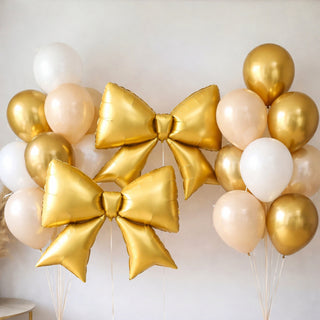 Gold balloon bows and balloons for festive decorations