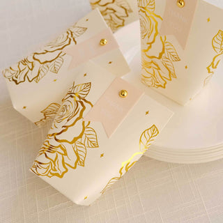 Gold-foiled rose-patterned gift boxes with "Thank You" tags on a light background.