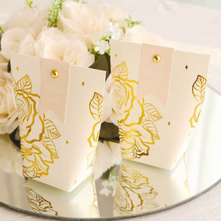 Elegant thank you gift boxes with floral design on a mirrored surface.