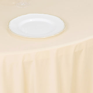 Experience Convenience and Allure with the Beige Premium Scuba Wrinkle-Free Round Tablecloth