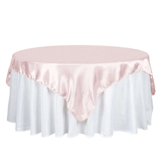 Add Elegance to Your Event with the Blush Satin Square Tablecloth Overlay Add Elegance to Your Event with the Blush Satin Square Tablecloth Overlay