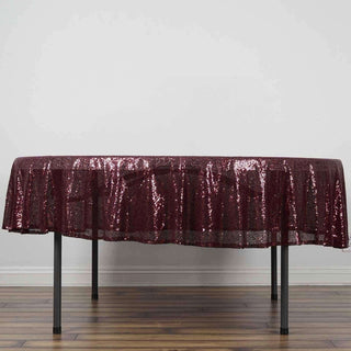 Burgundy sequin tablecloth draped over a table.