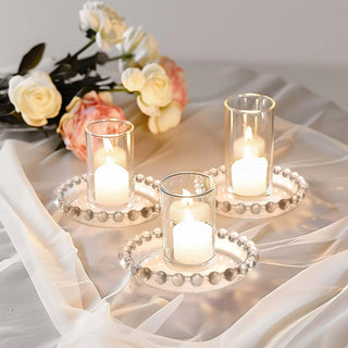 <strong>Stunning Beaded Rim Clear Glass Pillar Candle Holder Plates</strong> <strong>Stunning Beaded Rim Clear Glass Pillar Candle Holder Plates</strong>