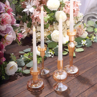 Transform Your Event Decor with the Set of 4 Assorted Amber Gold Glass Candle Stands Transform Your Event Decor with the Set of 4 Assorted Amber Gold Glass Candle Stands
