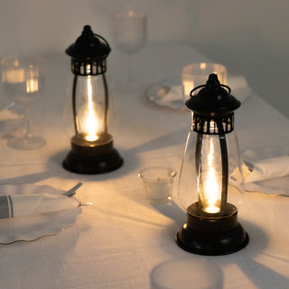 Vintage lanterns on a dining table, softly illuminating the setting.