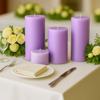 Set of purple candles with floral arrangement on a dining table.
