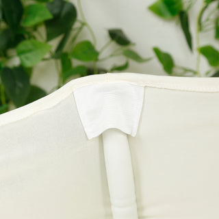 White chair cover with elastic bands and a secure fit for event seating.