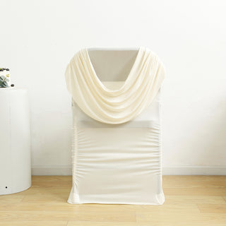 Cream draped chair cover on a plain backdrop.