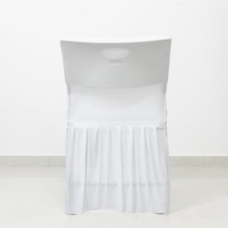 White folding chair with slipcover on a plain background