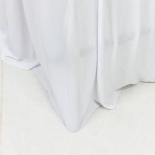 White tablecloth draping elegantly over a table edge.