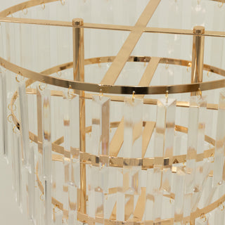 Elegant gold and crystal chandelier with hanging prisms.