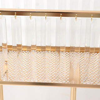 Gold and clear acrylic display shelf with hanging elements
