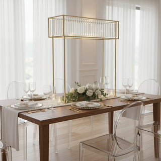 Elegant dining table set with glassware and floral centerpiece.