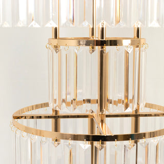 Elegant chandelier with crystal prisms and gold accents.
