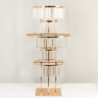 Elegant gold and crystal table lamp with three tiers of glass accents.