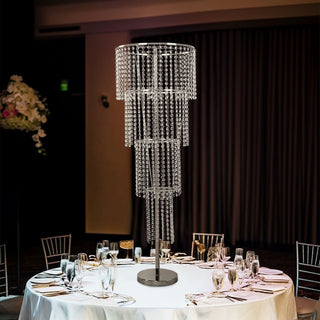 Elegant crystal chandelier on a dining table at a formal event.