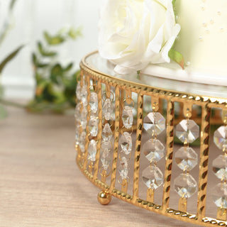 Gold crystal cake stand with decorative beads and floral accents.