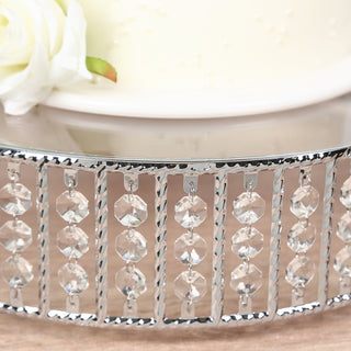 Crystal-studded cake stand with elegant design and floral accent.