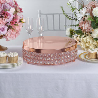 Elegant rose gold cake stand adorned with crystals, perfect for weddings and celebrations.