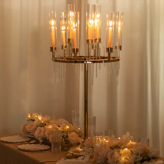 Elegant candle chandelier centerpiece with floral arrangements and soft lighting.