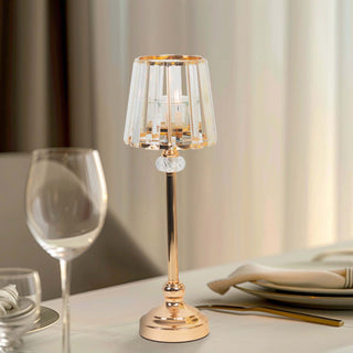 Elegant crystal table lamp with gold accents on a dining table.
