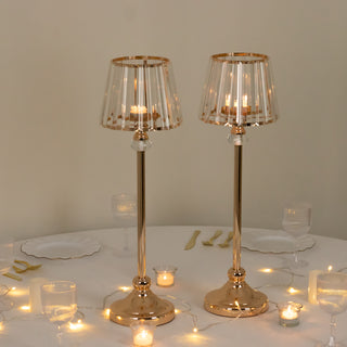Elegant gold table lamps with glass shades on a festive table setting.