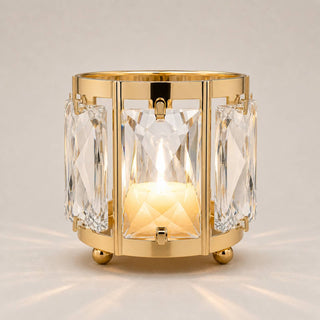 Gold crystal candle holder with faceted glass and warm glowing light