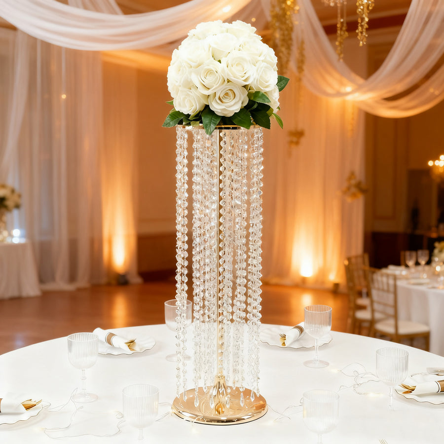 Elegant floral centerpiece with white roses and crystal embellishments.