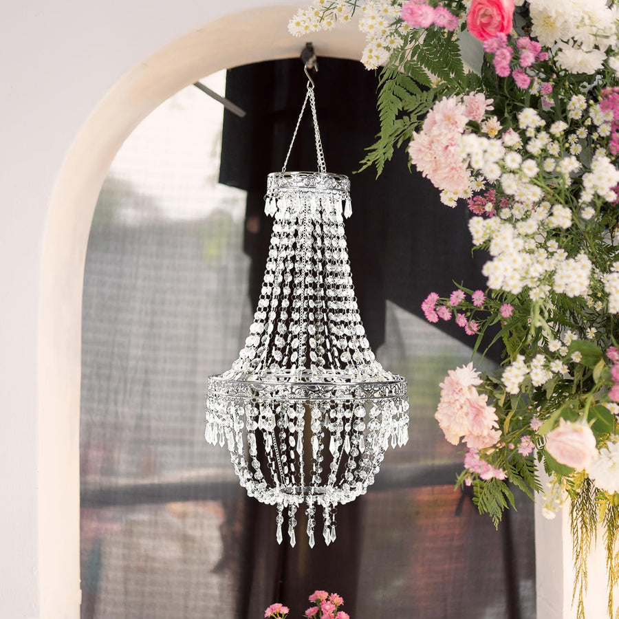 Elegant crystal chandelier hanging amidst floral decor.