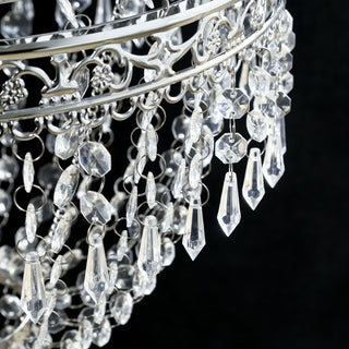 Elegant crystal chandelier with intricate metalwork and sparkling beads.