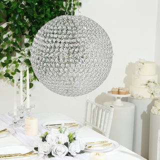 Elegant crystal chandelier hanging above a beautifully set dining table.