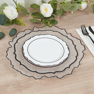 Elegant layered dinner plates with decorative edges on a wooden table.