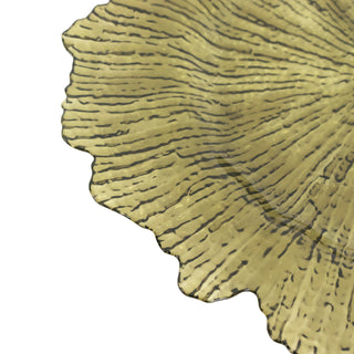 Decorative glass plate with textured leaf design in gold hue