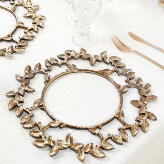 Gold leaf-shaped decorative charger plate on a textured tablecloth.