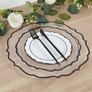 Elegant black and white dinnerware set with decorative plates and cutlery.