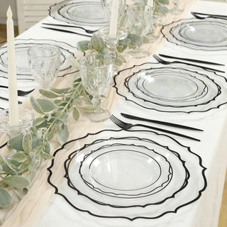Elegant black and clear glass dinner plates on a beautifully set table