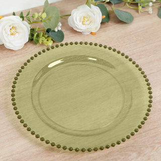 Green decorative plate with beaded rim on a wooden surface.