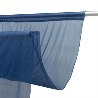 Blue sheer fabric panel hanging on a metal rod, close-up view
