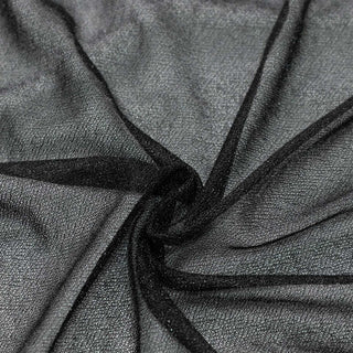 Black sheer mesh fabric texture close-up with folded layers#whtbkgd