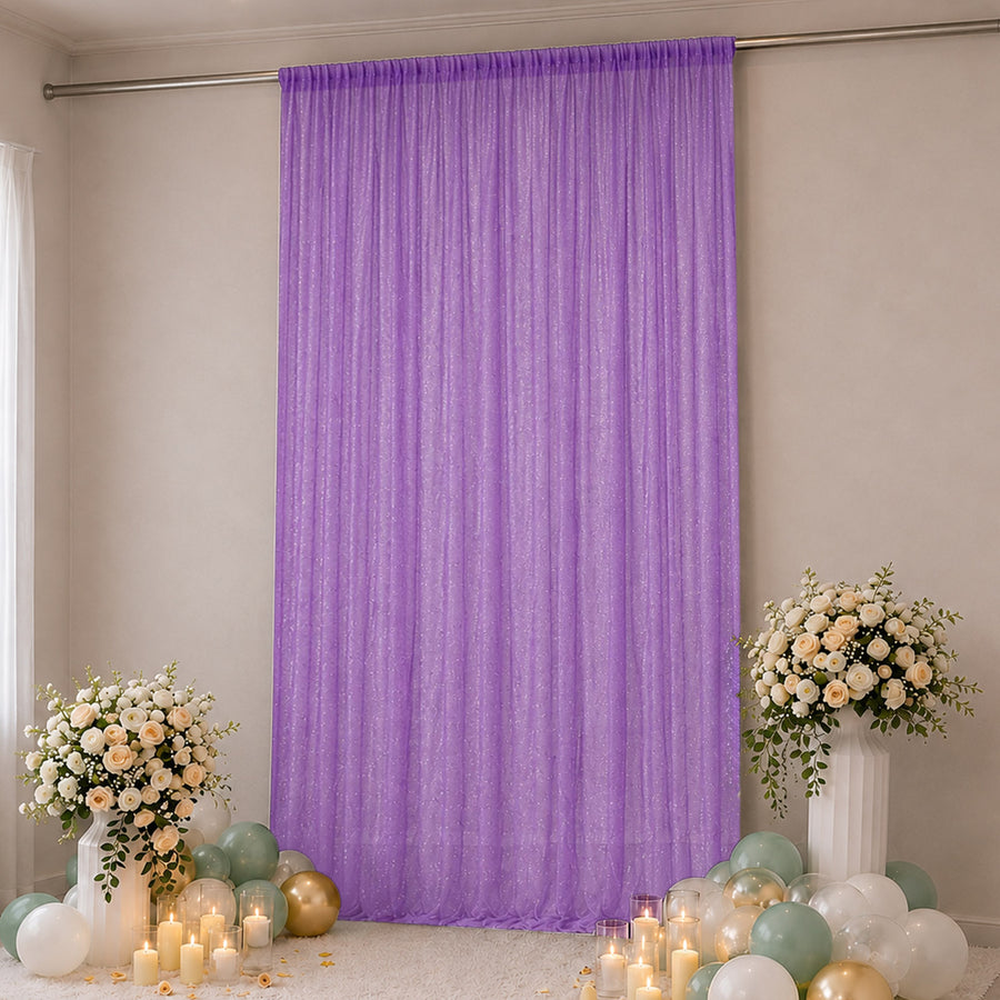Lavender purple sequin backdrop with floral arrangements and balloons for party decor